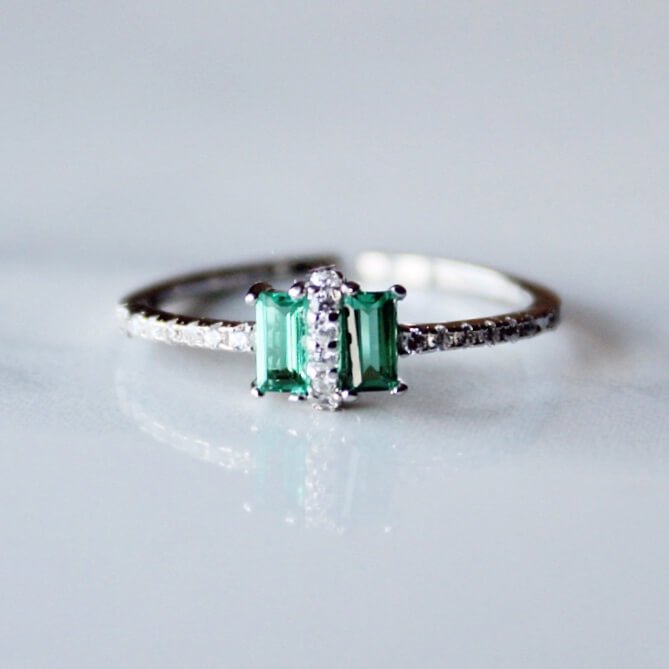 Green cubic zirconia ring with white zirconia setting